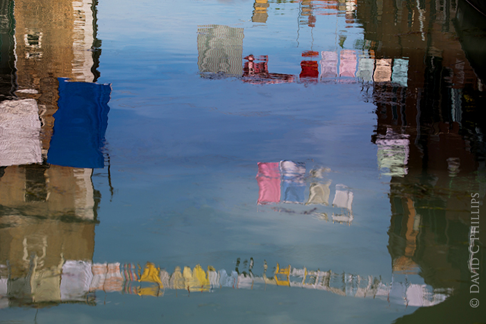 reflections of laundry in Venice Italy